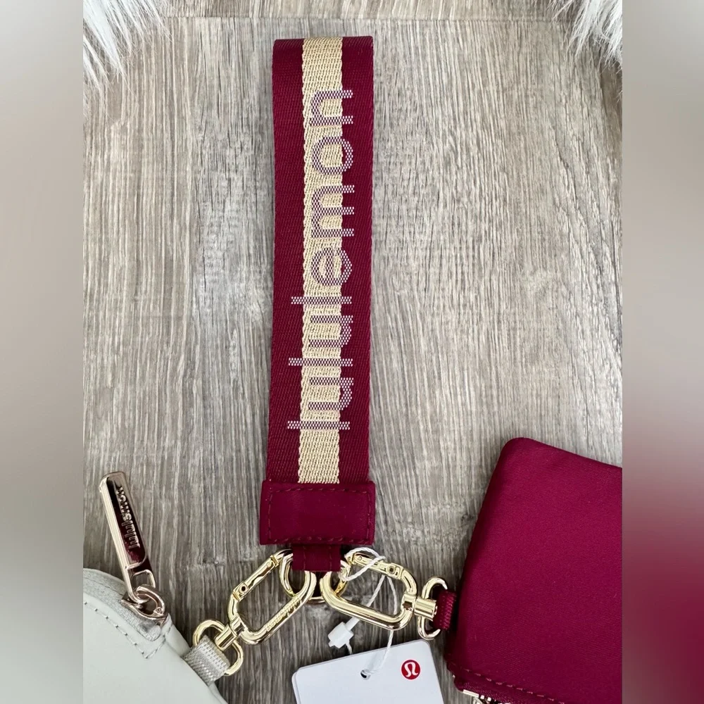 ❤️⭐️LULULEMON Dual Pouch Wristlet Wordmark Deep Luxe/Gold/Bone